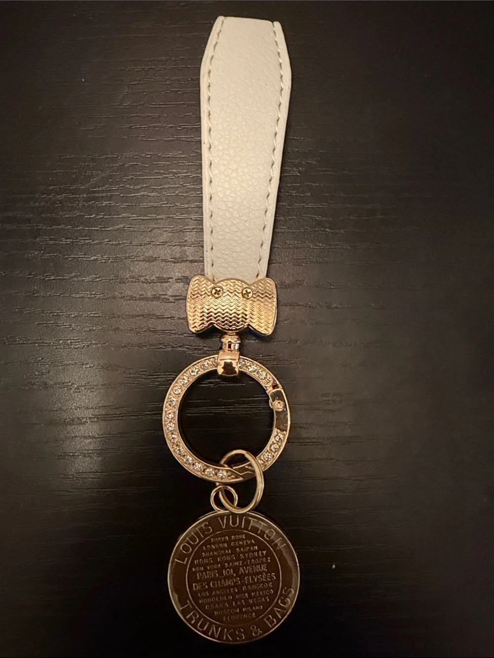 Inspired White Leather Strap Keychain with Brown Gold-Tone Medallion